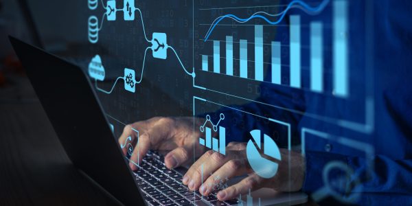 Analyst working with Business Analytics and Data Management System on computer to make report with KPI and metrics connected to database. Corporate strategy for finance, operations, sales, marketing